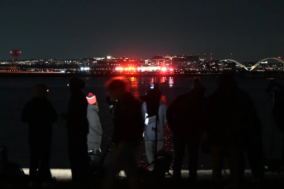 A view of the scene after the collision between an American Airlines plane and an Army helicopter in Washington, D.C., on January 30, 2025. | Source: Getty Images 